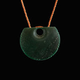 A hand crafted Goodletite Knotched Disc form Pendant necklace. 