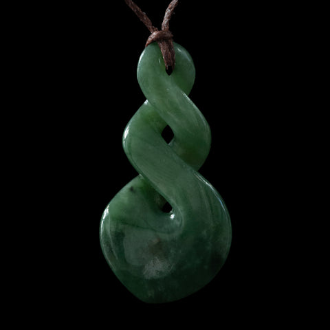 A New Zealand jade double twist pendant hand carved by Luke Gardiner