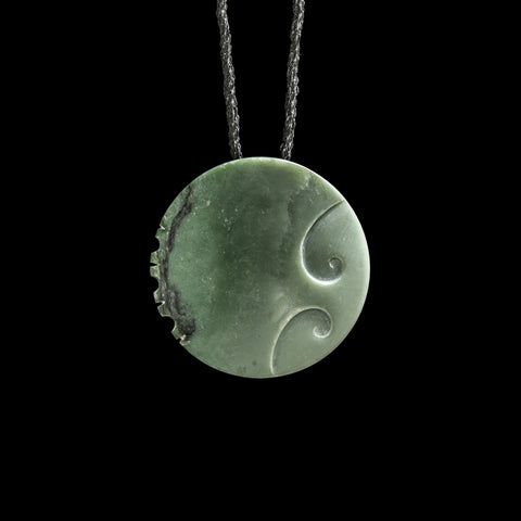 Jade disc pendant with korus by Madelyne Gourdin