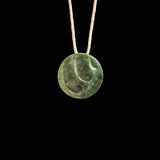 Jade disc pendant with korus by Madelyne Gourdin