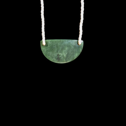 Small hand carved Jade Breast Plate style pendant by Madelyne Gourdin