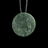 Jade disc pendant with korus by Nick and Mady