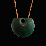 A hand crafted Goodletite Knotched Disc form Pendant necklace. 